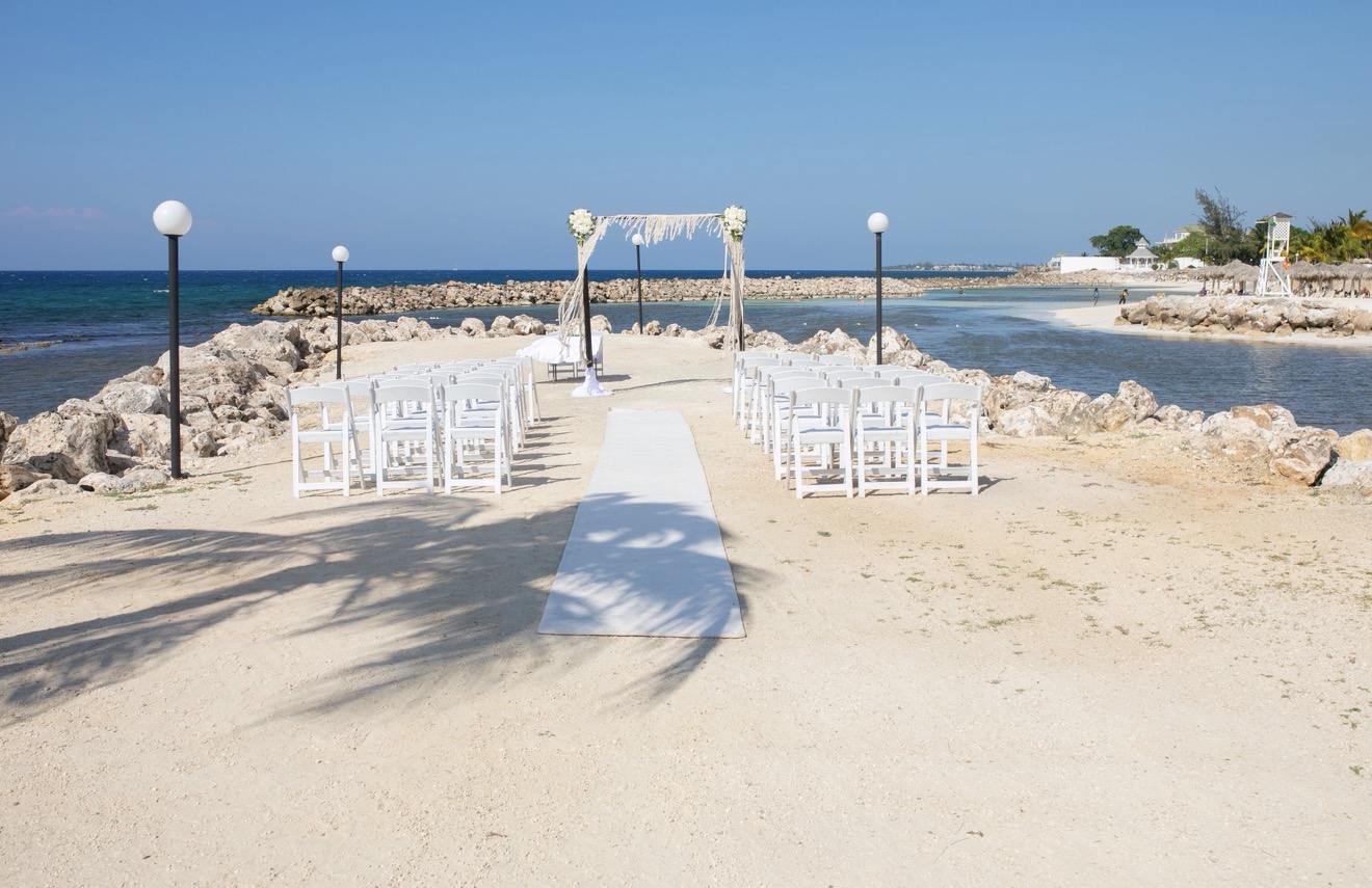 Beachfront destination wedding ceremony setup